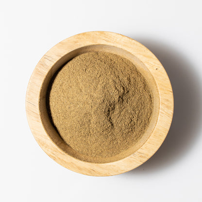 Banyan Kutaja powder in a wood bowl